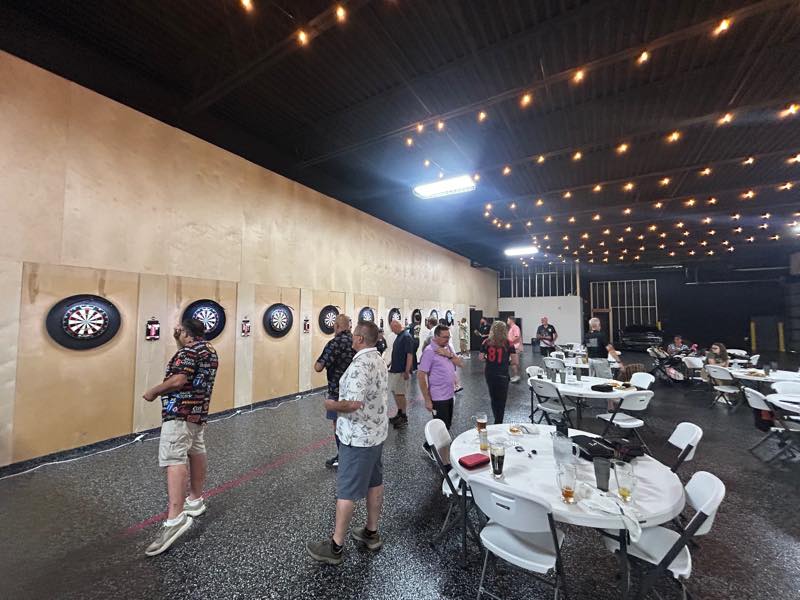 Tables and players filling the tournament room during an event.